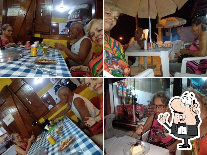 O interior do Pizzaria e Esfiharia NONNA III