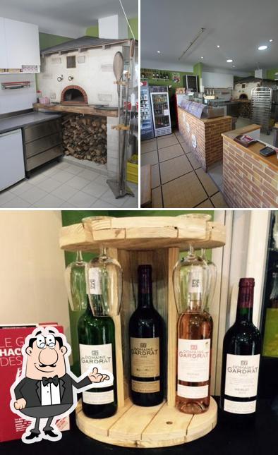 Jetez un coup d’oeil à la photo représentant la intérieur et vin concernant Four'As Pizz