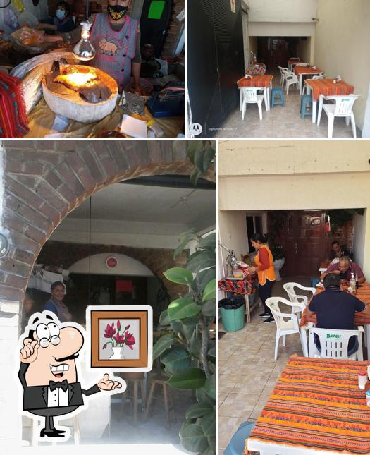 The picture of Barbacoa "Las Azucenas"’s interior and dining table