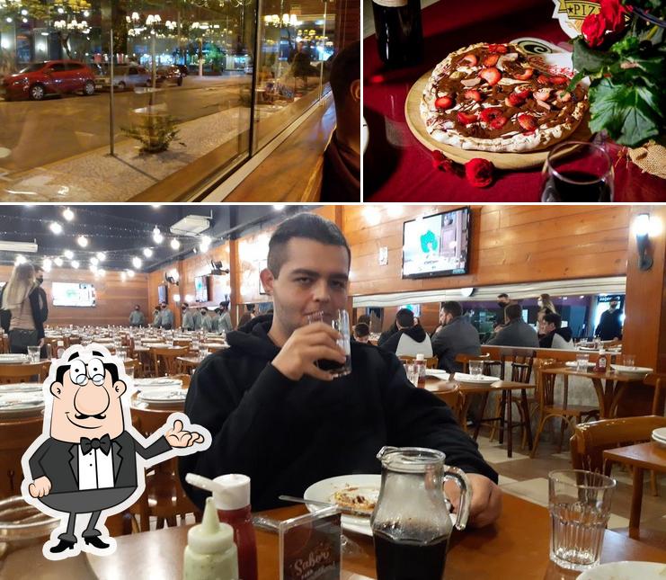 Entre diferentes coisas, interior e vinho podem ser encontrados no Cia do Sabor Pizzaria e Rodízio