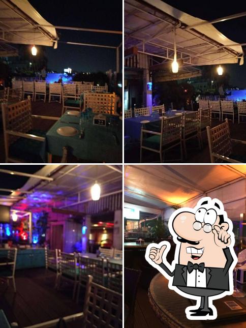 Take a seat at one of the tables at SKYE Rooftop by Eternia