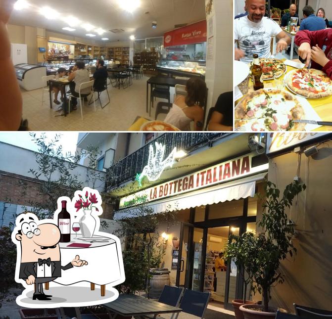 Questa è la foto che mostra la tavolo da pranzo e interni di ROSSO VIVO Shop e Food Experience | Pizzeria - Carne Pesce e Brace | anche senza Glutine