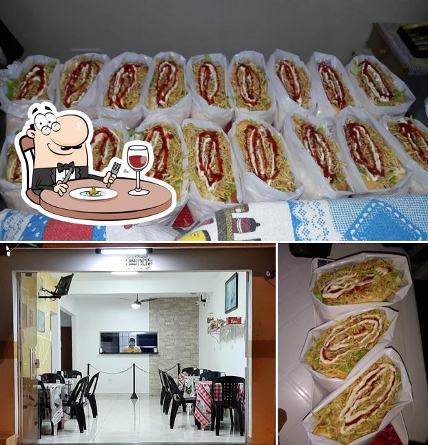 Dê uma olhada a imagem apresentando comida e interior no Edivaldo Lanches