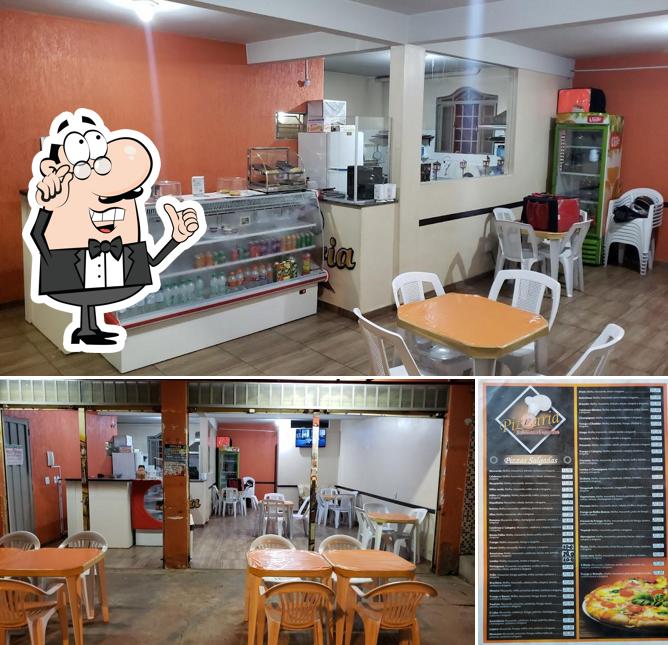 A imagem a Pizzaria Saborosa’s interior e pizza