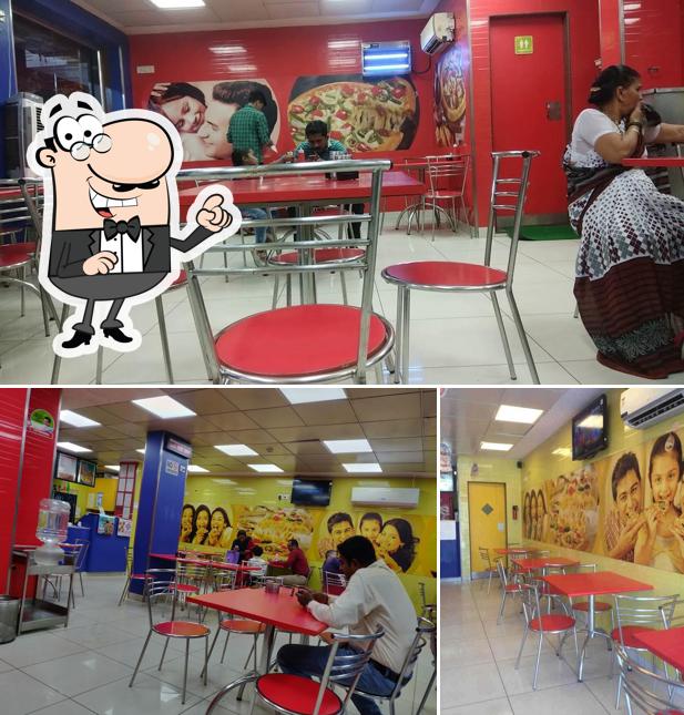 Take a seat at one of the tables at Domino's Pizza kamothe, Navi Mumbai