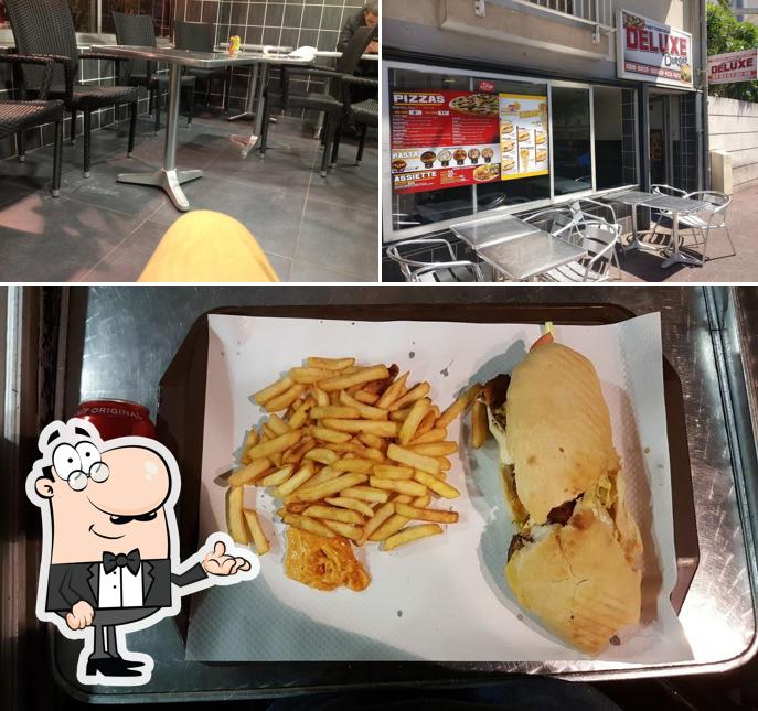 Voici l’image indiquant la intérieur et frites sur Deluxe Burgers