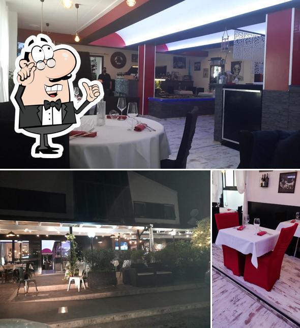 Installez-vous à l'une des tables de Enjoy - Pizzeria & Burgheria