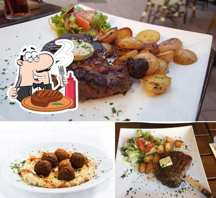 Try out meat dishes at Café Pavillon