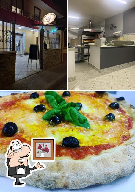 Pizzeria Mon Amour si caratterizza per la interni e pizza