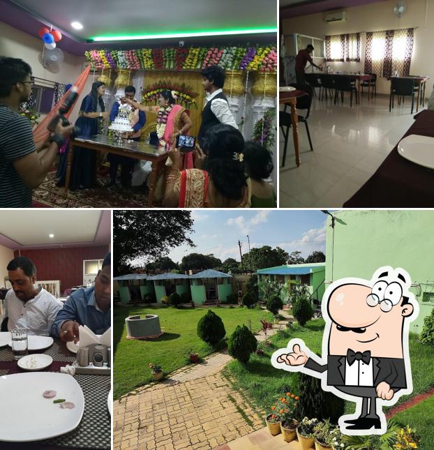 Take a seat at one of the tables at Ghar Aangan Restaurant