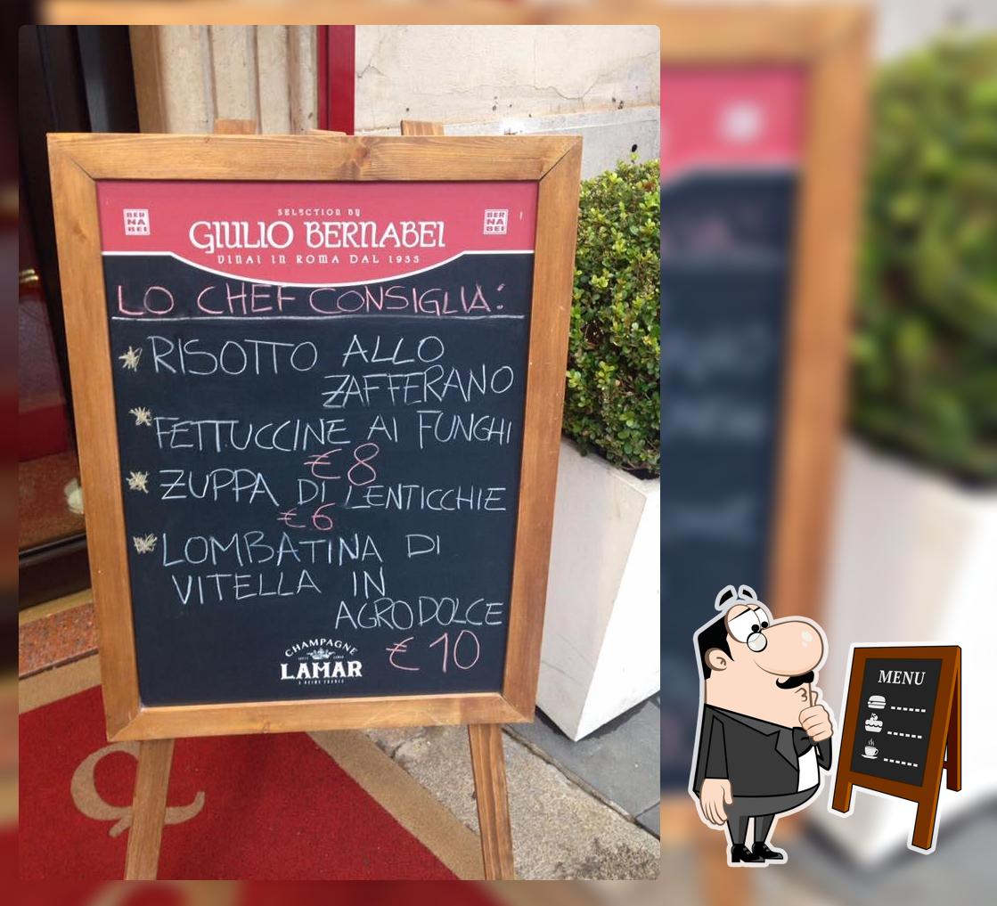 Ristorante Q'Art - Cucina e Vino presenta il menu scritto su una lavagna