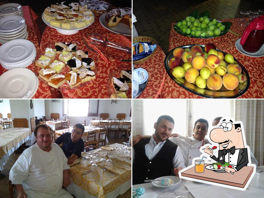 La foto di cibo e tavolo da pranzo da Hotel Alhambra