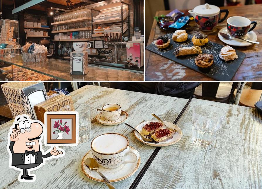 Tra le diverse cose da Fondi Dal 1936 - Bar - Pasticceria- Tavola Calda -ristorante si possono trovare la interni e tavolo da pranzo