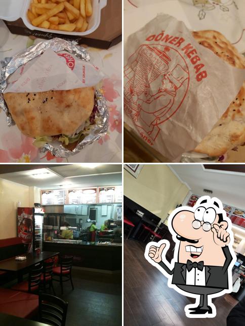 Посмотрите на этот снимок, где видны внутреннее оформление и еда в Bey Kebap u. Pizzahaus