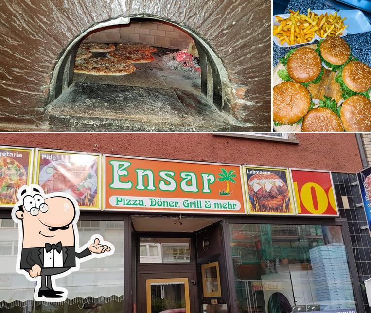 Снимок, на котором видны внутреннее оформление и бургеры в Edessa Kebab