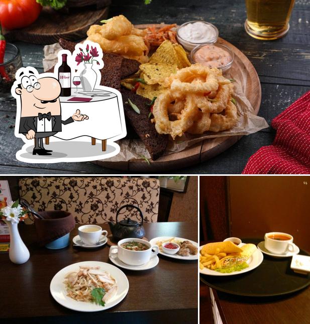 Jetez un coup d’oeil à l’image indiquant la table à manger et nourriture concernant Cafe Bolshiye Tarelki