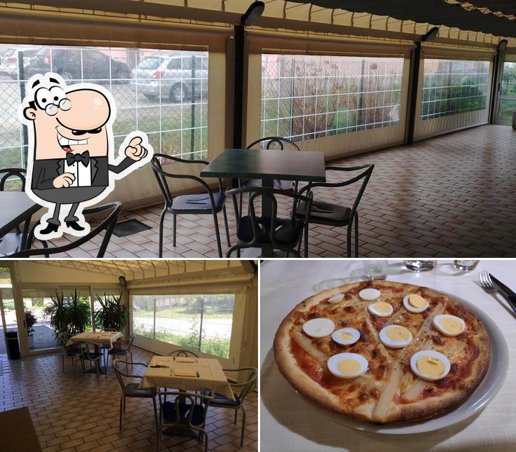 Sehen Sie das Foto von innere und pizza bei Pizzeria Trattoria Al Parini an