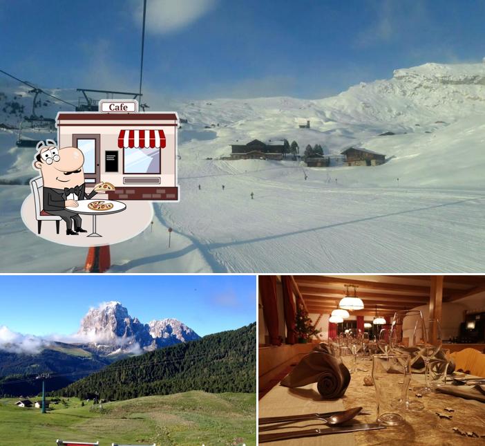 La immagine di esterno e tavolo da pranzo da Rifugio Fermeda Hütte