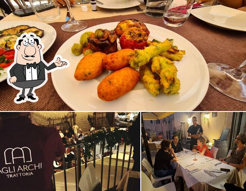 La immagine della interni e tavolo da pranzo di Trattoria Agli Archi