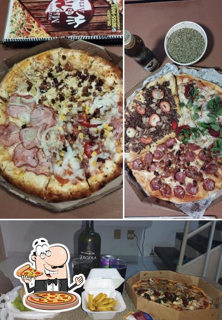 Consiga pizza no Pizzaria e Restaurante Mão na Arte