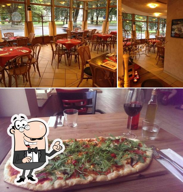 Check out the picture displaying interior and pizza at Babetti Ristorante