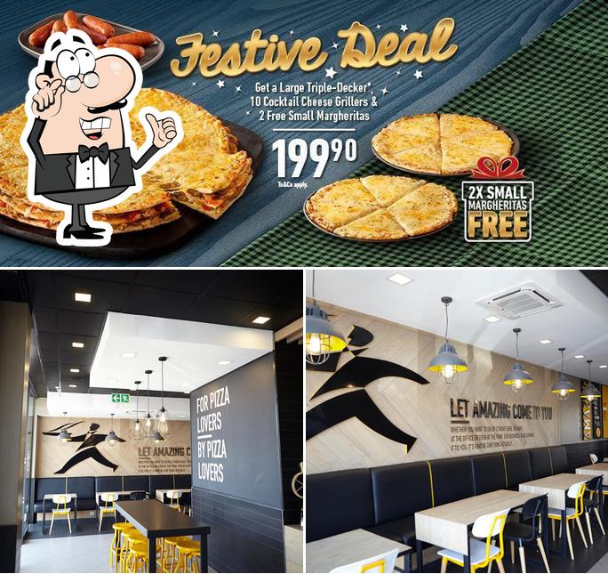 L’image de la intérieur et nourriture concernant Debonairs Pizza