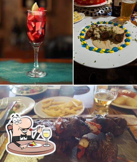 Take a look at the image depicting food and alcohol at El Parrillaje