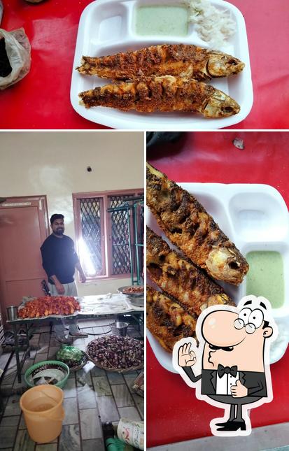 Look at the photo of AL-HAQ Chicken Point