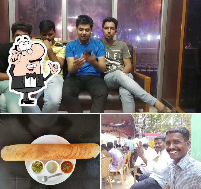 This is the picture depicting interior and beverage at Hotel Vignesh