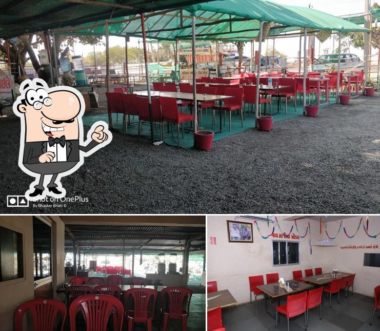 Take a seat at one of the tables at Gopal Kathiyavadi Hotel