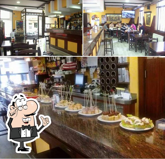 Check out the photo displaying interior and food at Tapería Pulpería Inocente