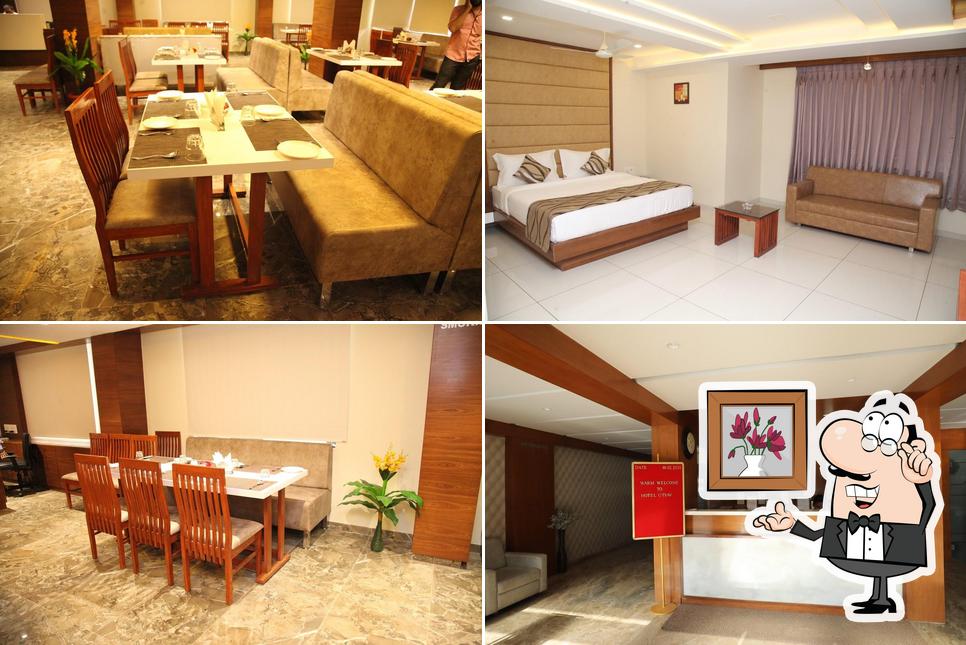 Take a seat at one of the tables at Hotel Utsav And Restaurant