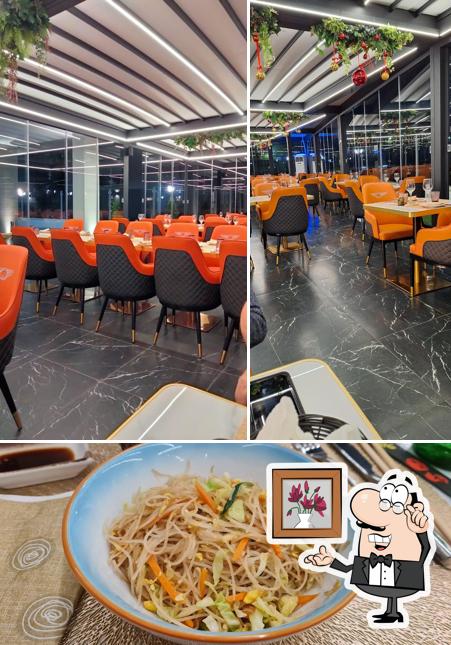 Dai un’occhiata alla immagine che presenta la interni e cibo di Sushi King