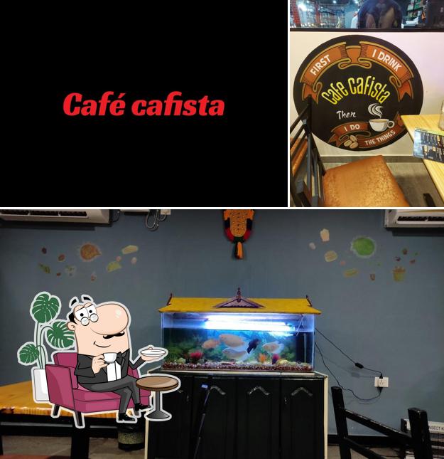 Take a seat at one of the tables at Cafe Cafista