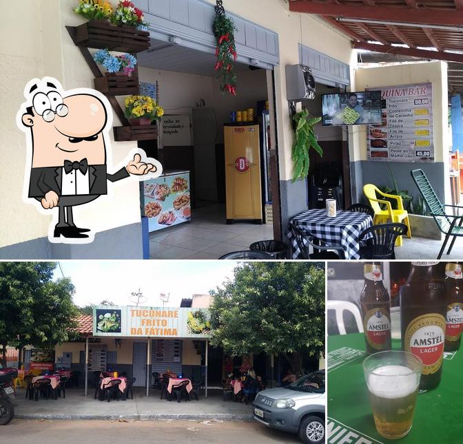 A foto a Tucunaré frito da Fátima’s interior e cerveja