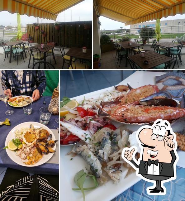 Siediti a un tavolo di Bar ristorantino Vista sul Mare (Portomaran)