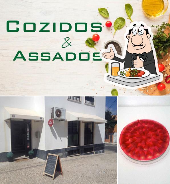 Снимок, на котором видны еда и доска для меню в Cozidos e Assados
