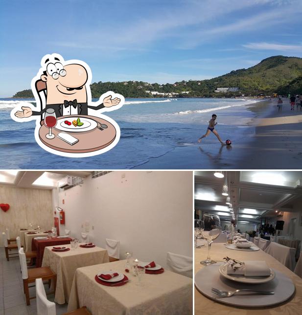 O Restaurante Prazeres do Mar se destaca pelo mesa de jantar e exterior