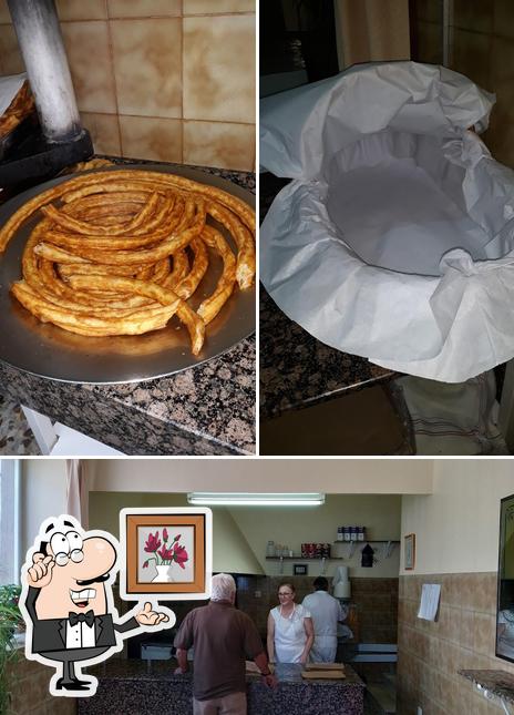 Это снимок, где изображены внутреннее оформление и еда в churreria Virgen de la Paz