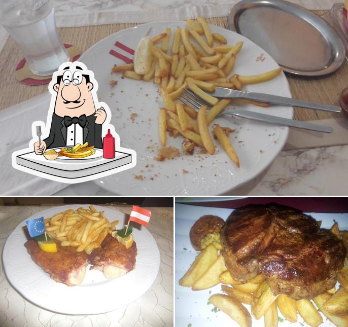 Disfruta de sus patatas a la francesa en Zum Schnitzelwirt