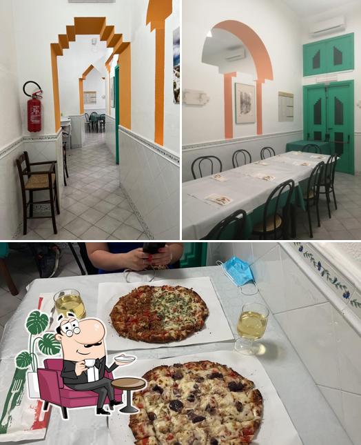 Tra le varie cose da Pizzeria Calvino si possono trovare la interni e cibo