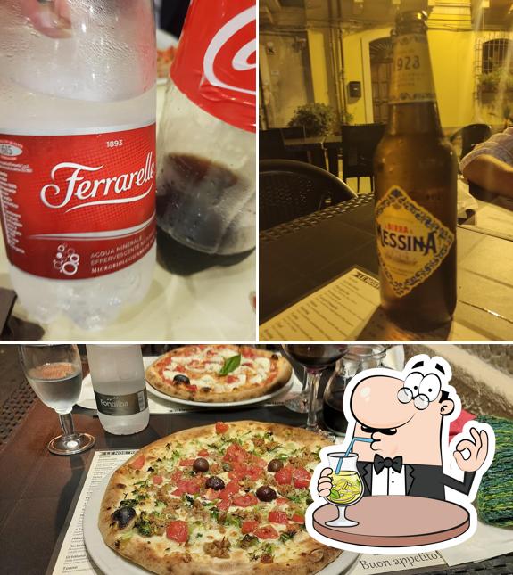 This is the picture displaying drink and pizza at La Trinacria