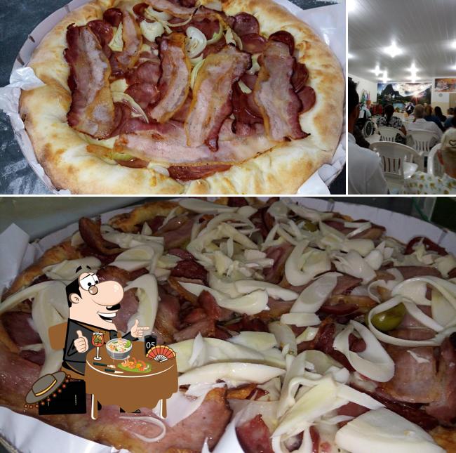 Esta é a foto apresentando comida e interior a Anny Pizzaria