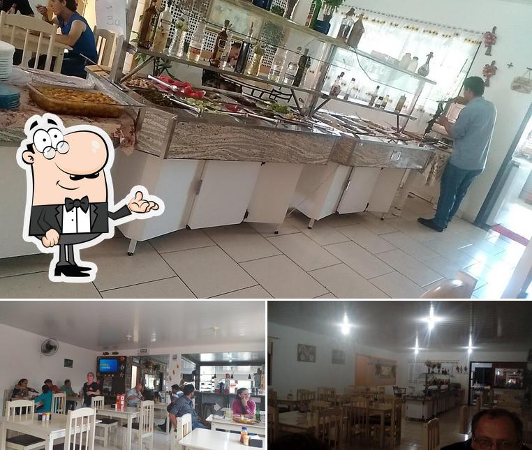 Sente em uma das mesas no Restaurante e Lanchonete do Pelego