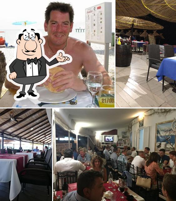 Siediti a un tavolo di Restoran Amadeus