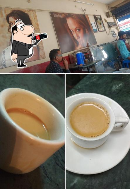 Take a look at the image displaying drink and interior at Blue Sea Cafe