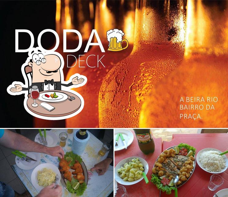 A imagem do DODA DECK Tijucas SC’s mesa de jantar e cerveja