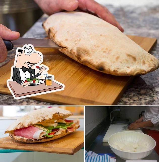 Un pezzo di pizza si caratterizza per la cibo e interni