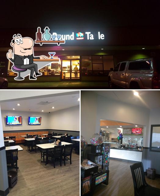 Take a look at the picture displaying interior and exterior at Round Table Pizza