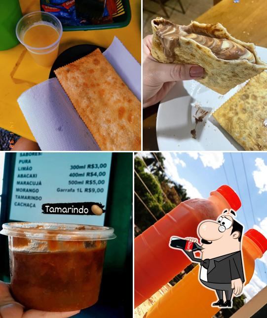 Confira a imagem mostrando bebida e comida no Garapa Tropical M&G